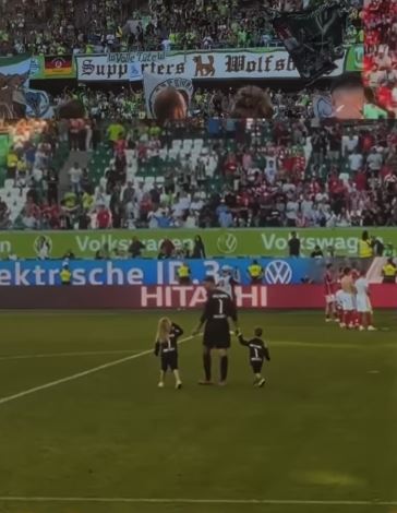 Koen Casteels with his son and daughter on the football ground